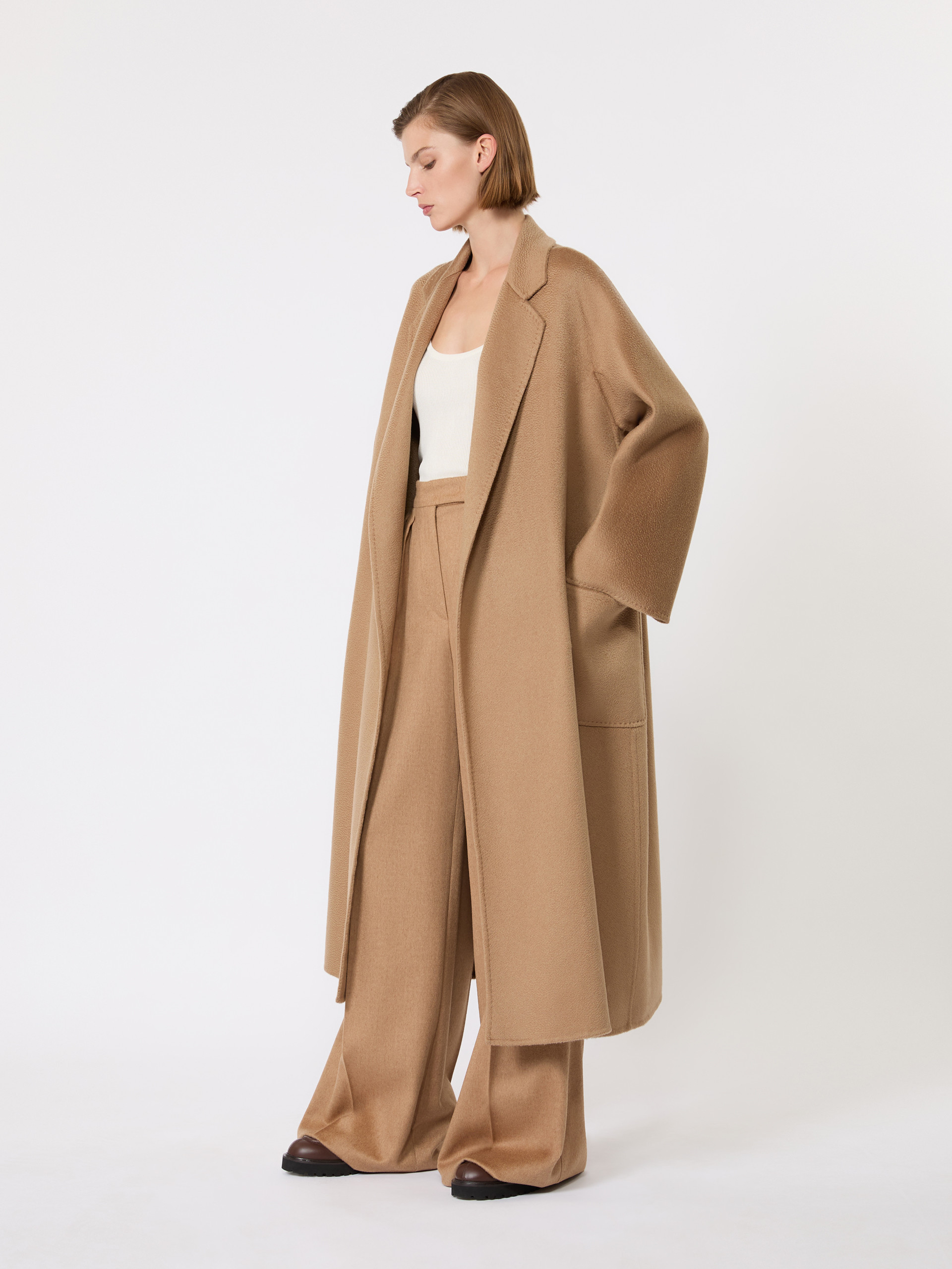 Model in the open Max Mara Ludmilla Icon Coat in camel cashmere