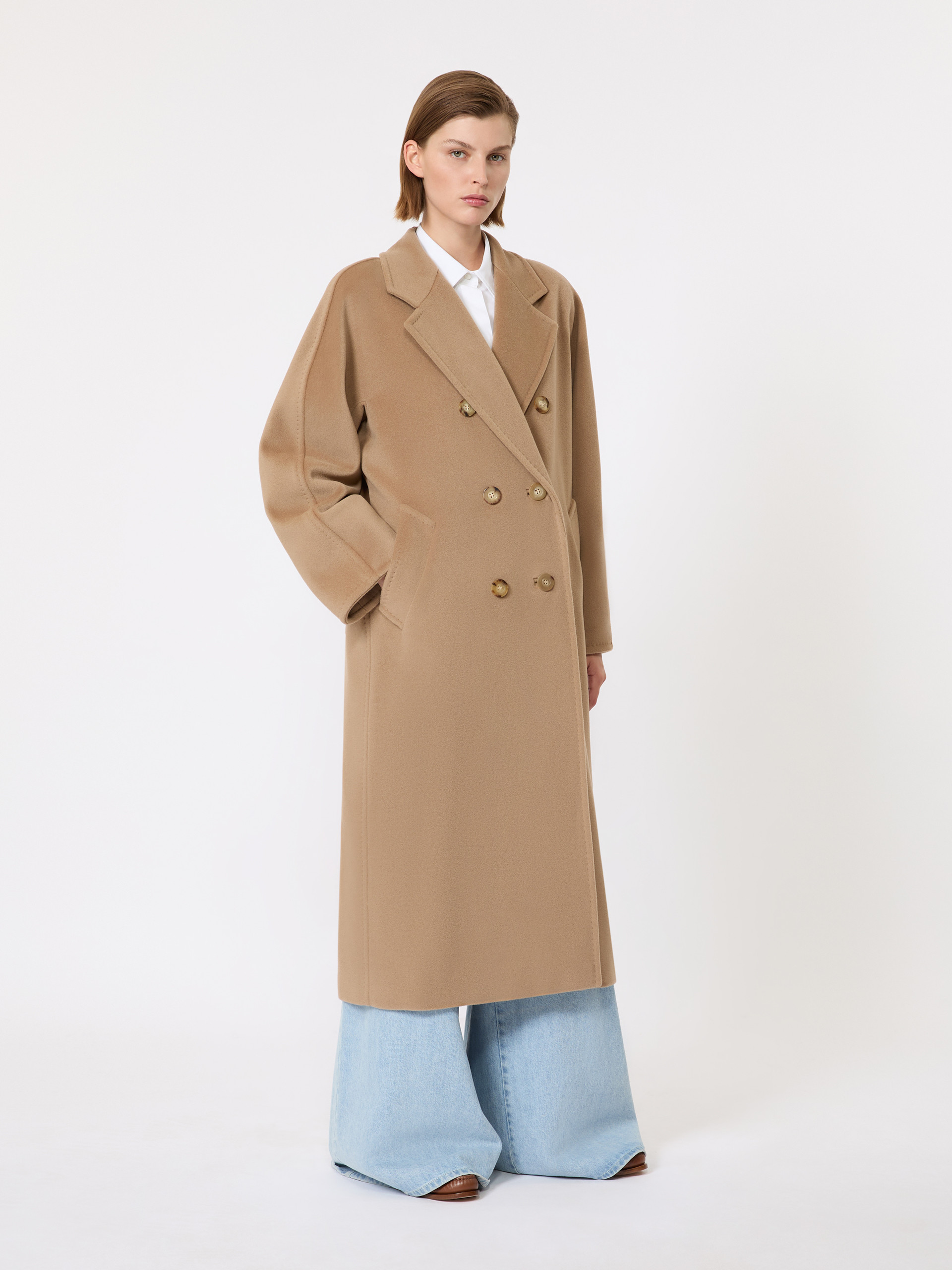 Side view of the camel Max Mara 101801 coat showing the double-breasted front and kimono sleeves
